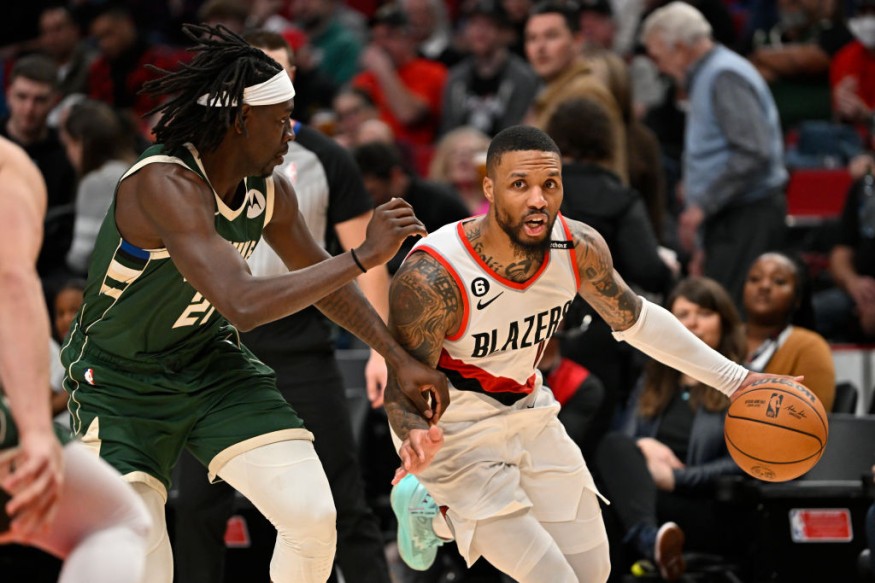 Jrue Holiday and Damian Lillard - Milwaukee Bucks v Portland Trail Blazers